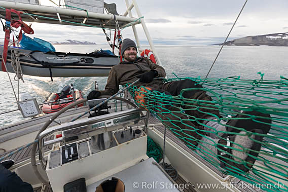 Skipper Peter working hard, fully concentrated during a difficult passage